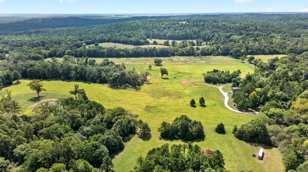 Wide aerial landscape view of the property